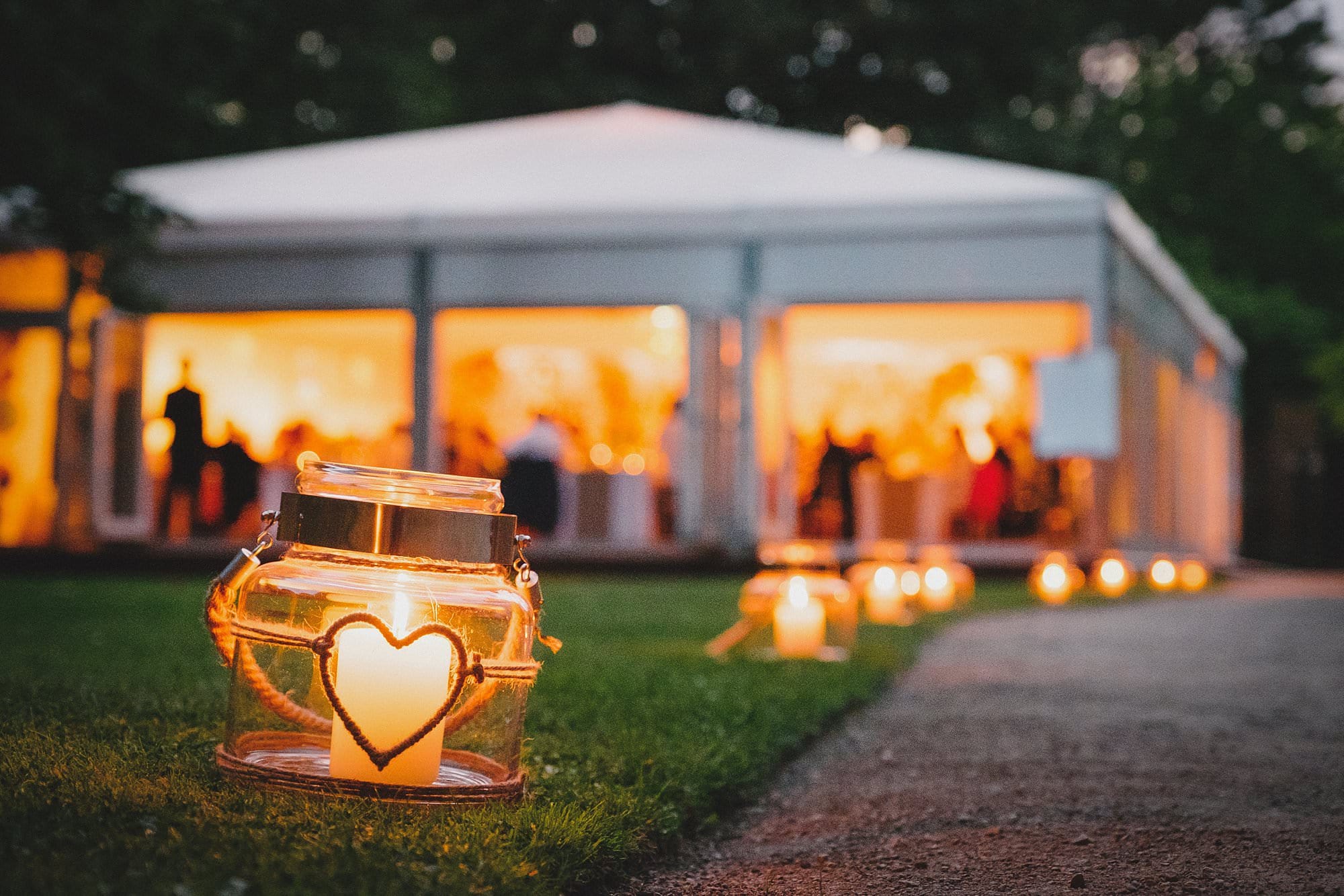 candles light the way to the wedding breakfast marquee