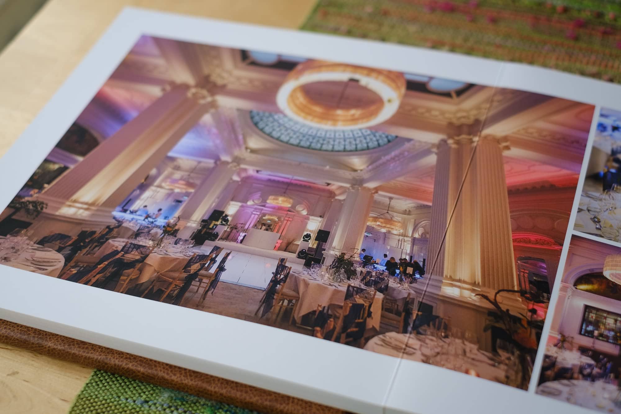 closeup of a fine art wedding album featuring London wedding photography at the andaz hotel