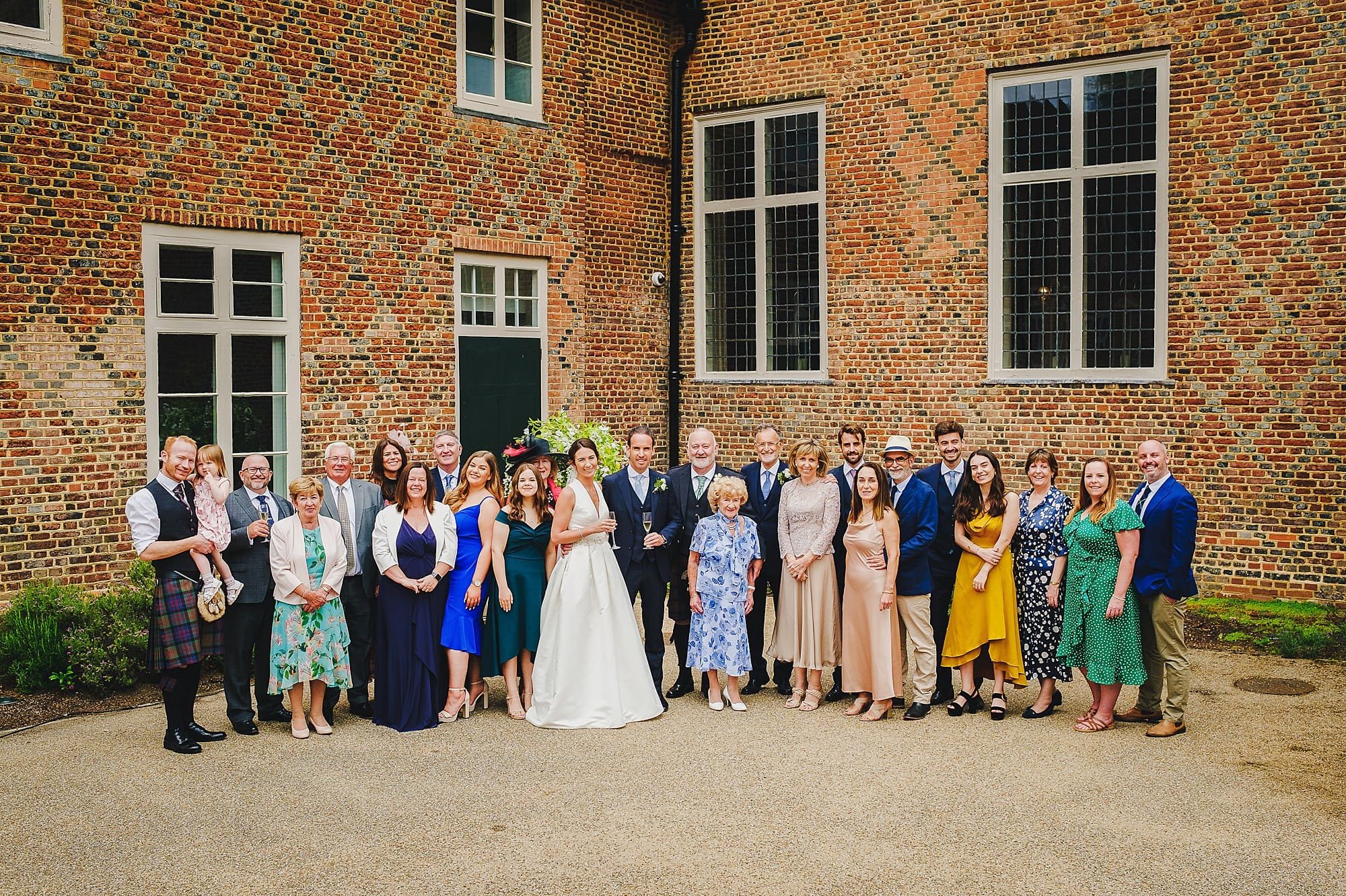 family portrait in Fulham Palace courtyard wedding reception